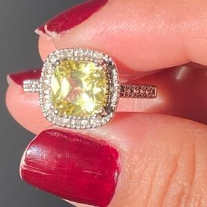 10k white gold halo ring featuring a cushion-cut yellow-green center stone
